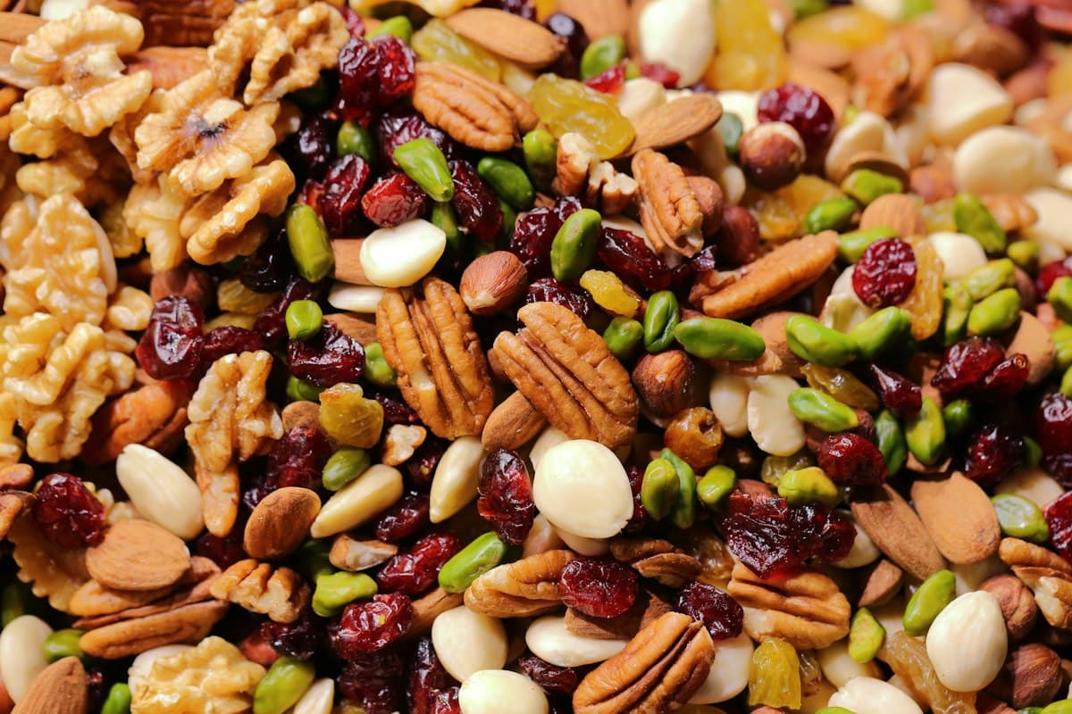 Almonds, pistachios, cashews and dried cranberries in a compartment tray